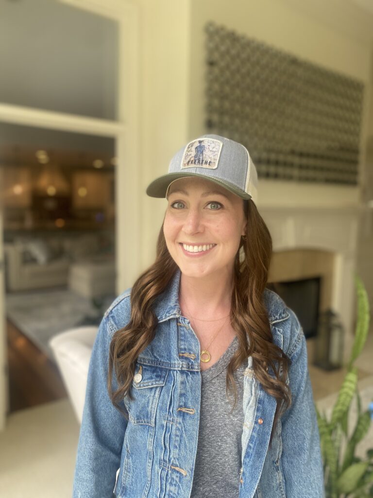 woman wearing hat with hair insert